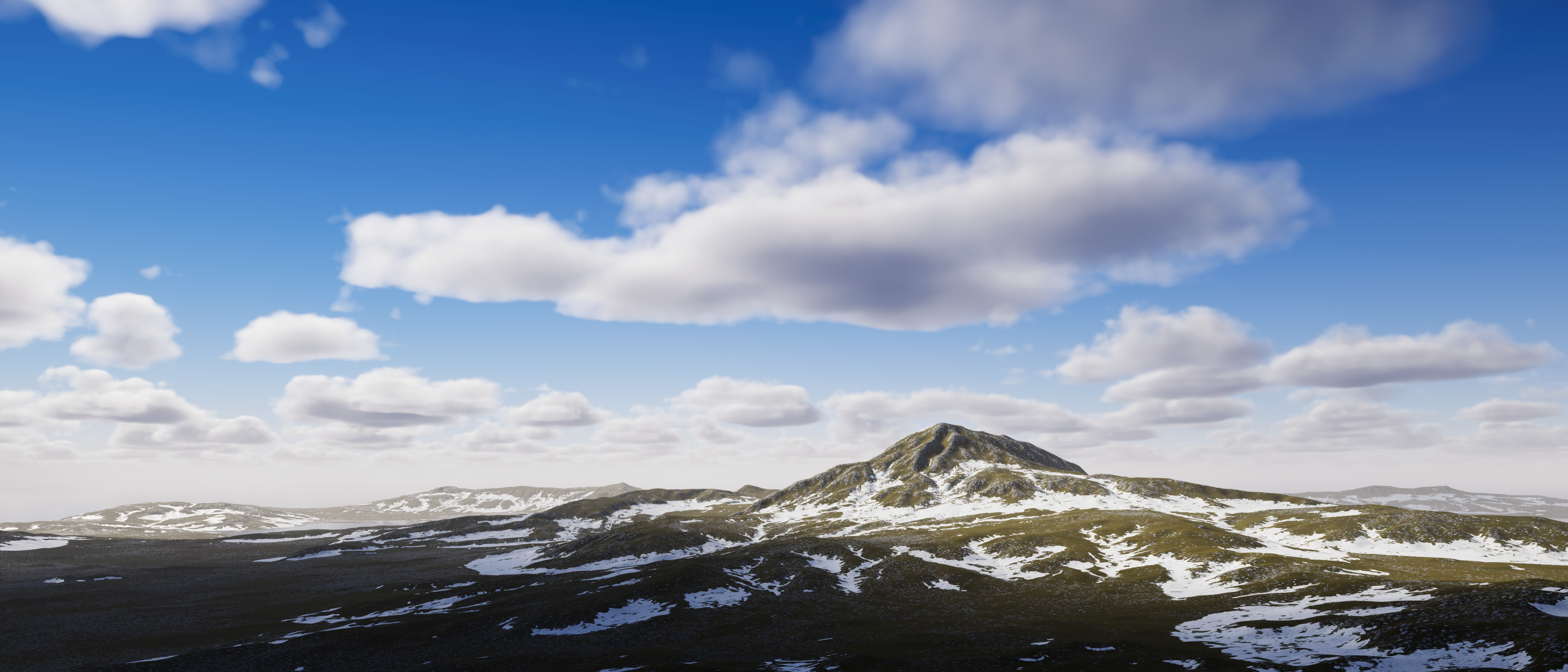 Image of blue sky with clouds over a snowy mountain and terrain