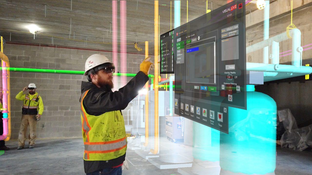 Construction working pointing at an augmented reality screen