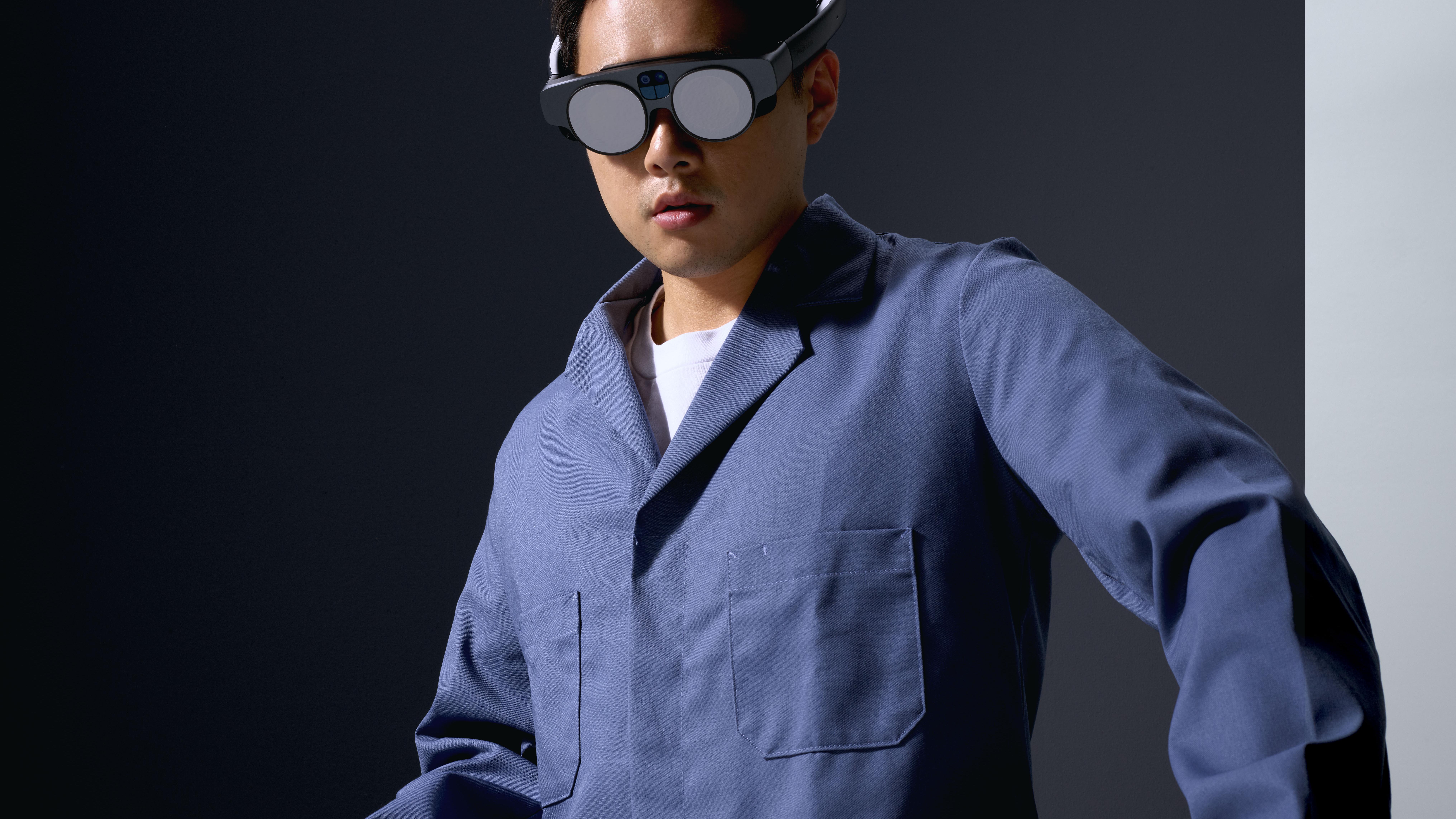 Image of Asian man in action, using the Magic Leap 2 headset