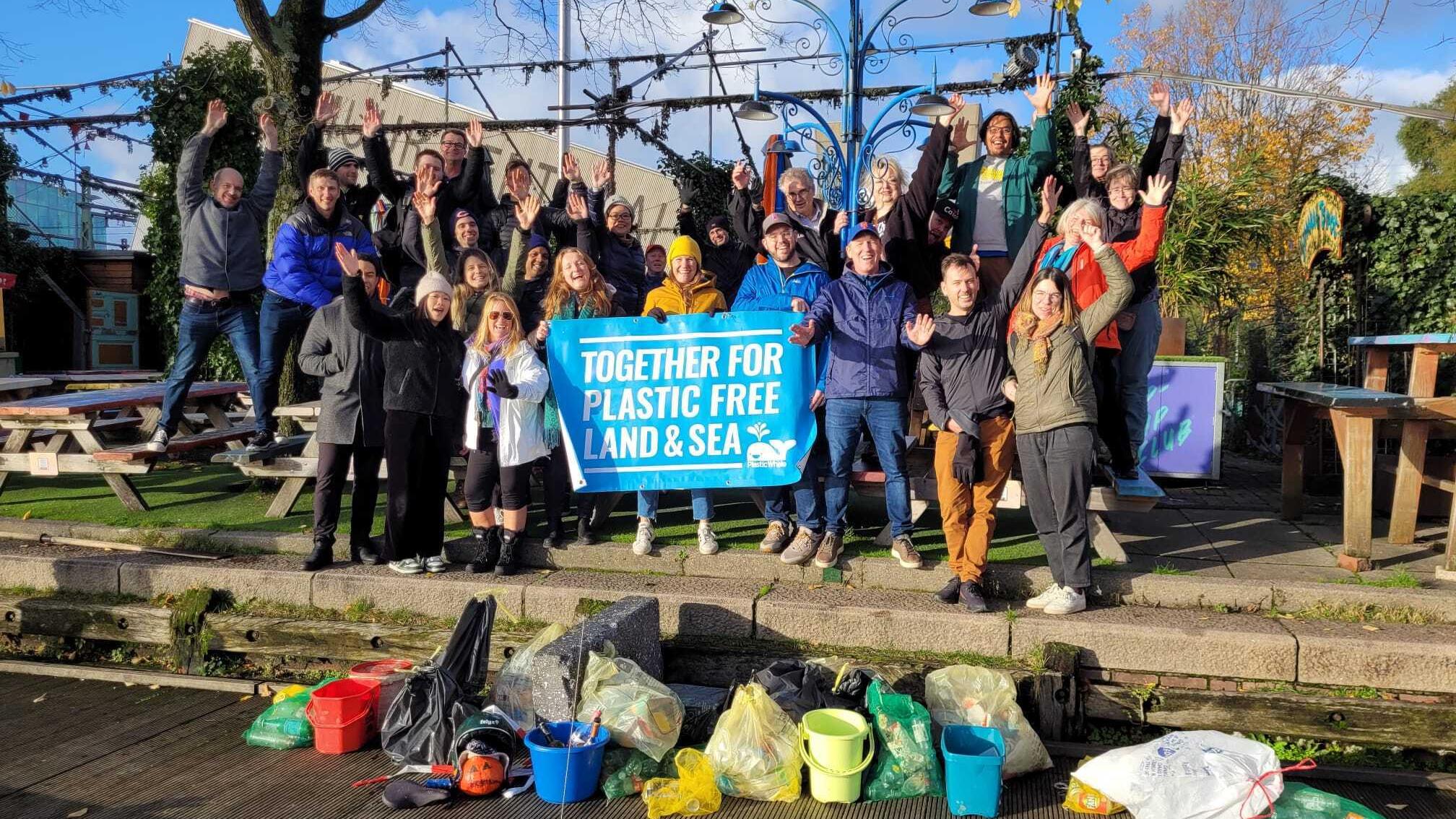 Group photo of Unity volunteers who helped clean trash out of the Amsterdam canals