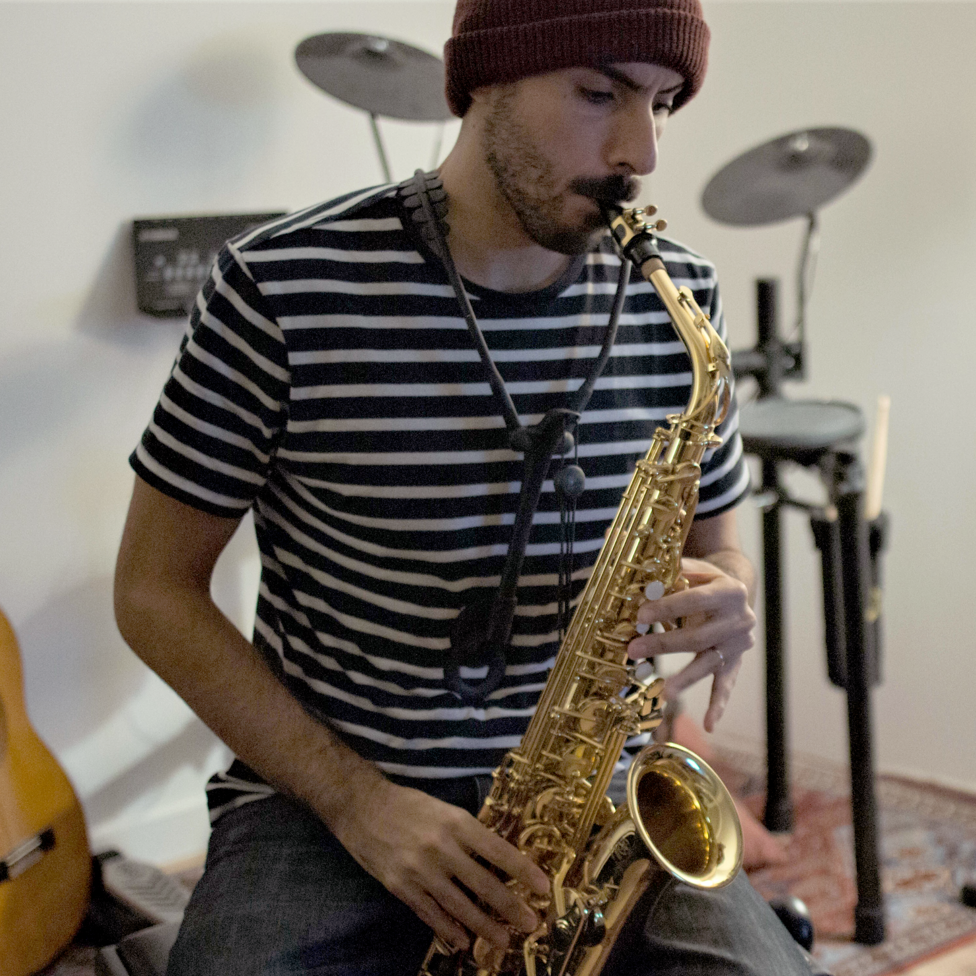 Photo of Anis playing the saxophone