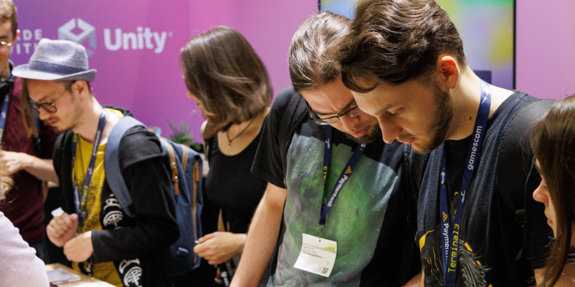 Image of attendees in the Unity booth at gamescom 2022 (hero)