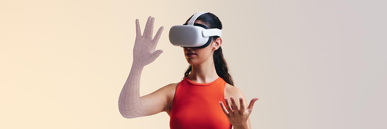 person with virtual reality headset on while looking at their hand