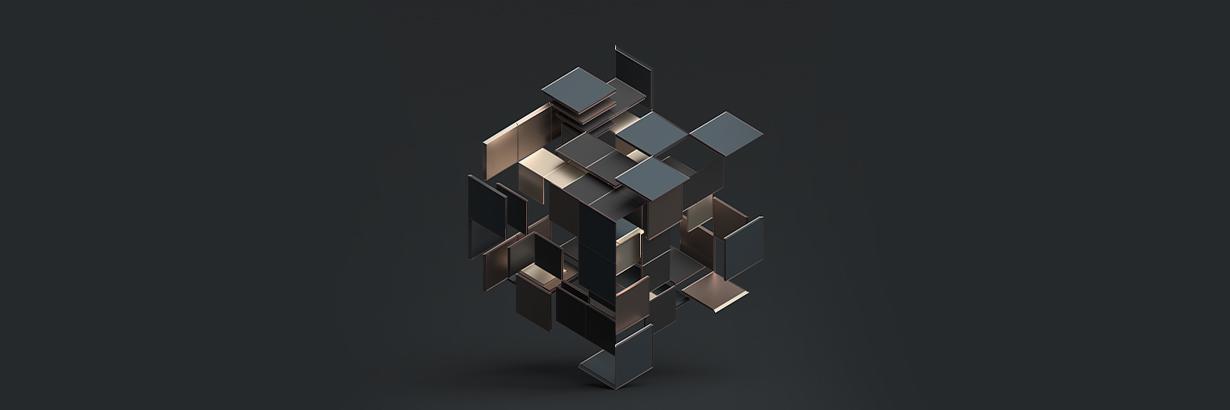 A metallic abstract cube on a black background